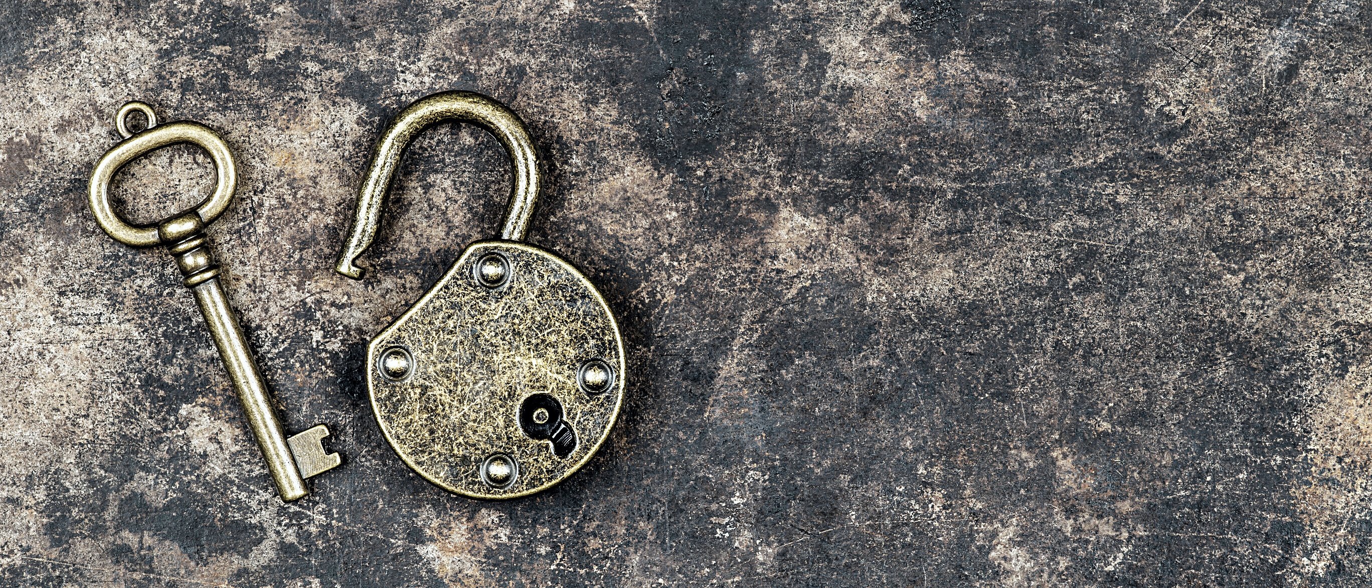 Escape room game concept old vintage key on and padlock